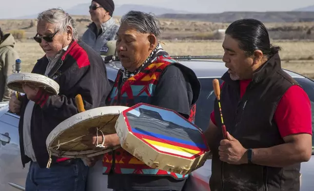 Big Wind Singers Lyle Oldman, from left, Wayland Bonatsie and Jake Hill perform a Sun Dance song during the buffalo release at the Eastern Shoshone Buffalo Enclosure on Friday, April 11, 2025, on the Wind River Reservation near Morton, Wyo. (AP Photo/Amber Baesler)