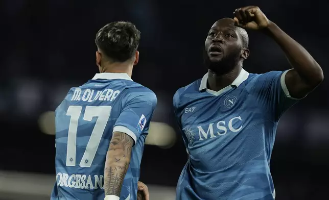 Napoli's Romelu Lukaku celebrates after scoring during the Serie A soccer match between Napoli and Empoli at the Diego Armando Maradona Stadium in Naples, Italy, Monday, April 14 , 2025. (Alessandro Garofalo/LaPresse via AP)