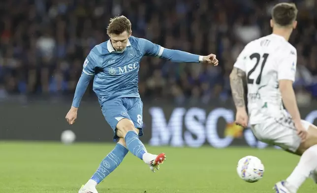 Napoli's Scott McTominay scores the opening goal during the Serie A soccer match between Napoli and Empoli at the Diego Armando Maradona Stadium in Naples, Italy, Monday, April 14 , 2025. (Alessandro Garofalo/LaPresse via AP)