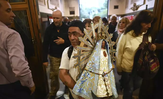 Faithful attend Mass for the late Pope Francis at the Basílica de San José de Flores, where he worshipped as a youth, in Buenos Aires, Argentina, Monday, April 21, 2025. (AP Photo/Mario De Fina)