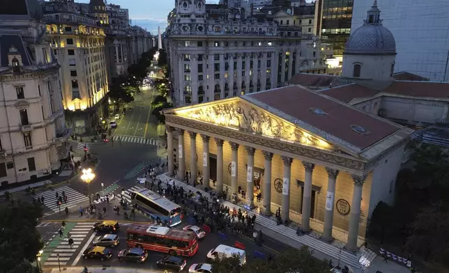 People gather for the late Pope Francis outside the Cathedral in Buenos Aires, Argentina, Tuesday, April 22, 2025. (AP Photo/Rodrigo Abd)