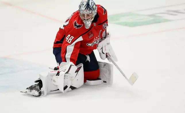Washington Capitals goaltender Logan Thompson stops the puck in the third period of Game 2 of a first-round NHL hockey playoff series against the Montreal Canadiens Wednesday, April 23, 2025, in Washington. (AP Photo/Nick Wass)
