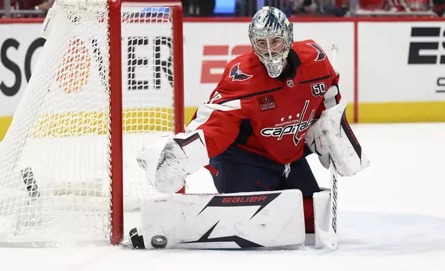 Washington Capitals goaltender Logan Thompson (48) stops the puck in the second period of Game 2 of a first-round NHL hockey playoff series against the Montreal Canadiens, Wednesday, April 23, 2025, in Washington. (AP Photo/Nick Wass)