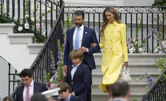 Donald Trump Jr., and his girlfriend Bettina Anderson arrive for the White House Easter Egg Roll on the South Lawn of the White House, Monday, April 21, 2025, in Washington. (AP Photo/Alex Brandon)