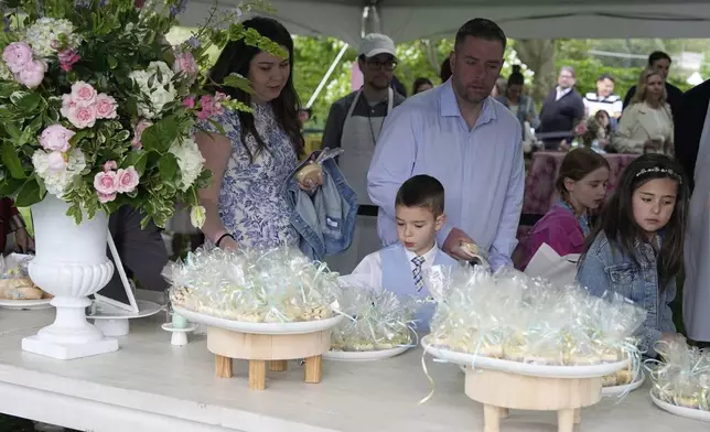 Guests arrive on the South Lawn of the White House before President Donald Trump and first lady Melania Trump participate in the White House Easter Egg Roll Monday, April 21, 2025, in Washington. (AP Photo/Alex Brandon)