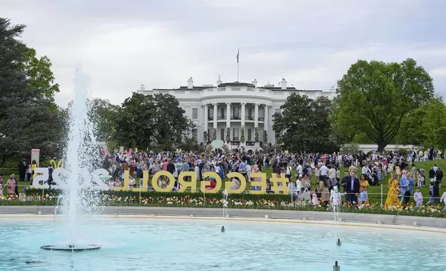Guests arrive on the South Lawn of the White House before President Donald Trump and first lady Melania Trump participate in the White House Easter Egg Roll Monday, April 21, 2025, in Washington. (AP Photo/Alex Brandon)