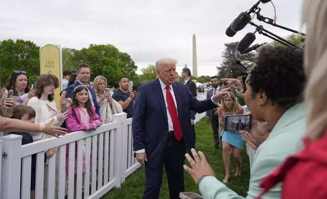 President Donald Trump greets people during the White House Easter Egg Roll on the South Lawn of the White House, Monday, April 21, 2025, in Washington. (AP Photo/Alex Brandon)