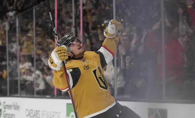 Vegas Golden Knights right wing Alexander Holtz (26) celebrates after scoring against the Nashville Predators during the second period of an NHL hockey game Saturday, April 12, 2025, in Las Vegas. (AP Photo/John Locher)