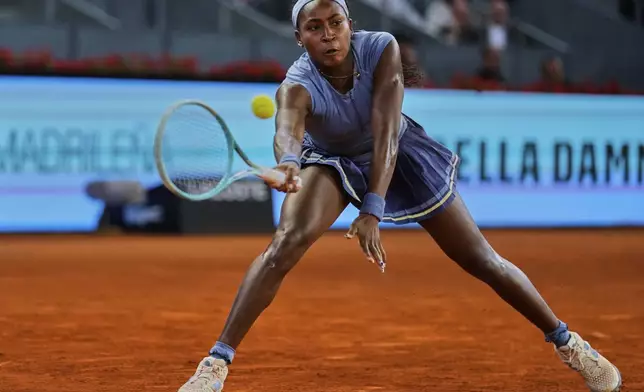 United States' Coco Gauff returns the ball against Ukraine's Dayana Yastremska during the Madrid Open tennis tournament in Madrid, Spain, Thursday, April 24, 2025. (AP Photo/Manu Fernandez)