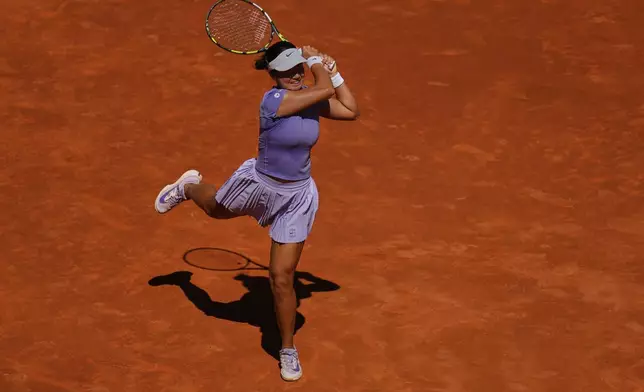 Alexandra Eala of Philippines returns the ball during her match against Poland's Iga Swiatek during the Madrid Open tennis tournament in Madrid, Spain, Thursday, April 24, 2025. (AP Photo/Manu Fernandez)