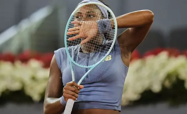 United States' Coco Gauff celebrates after her win over Ukraine's Dayana Yastremska at the Madrid Open tennis tournament in Madrid, Spain, Thursday, April 24, 2025. (AP Photo/Manu Fernandez)