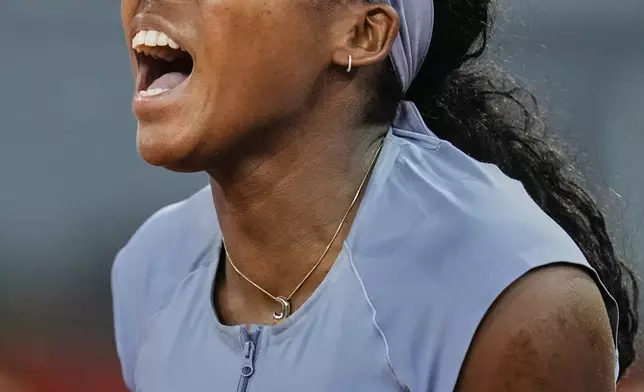 United States' Coco Gauff celebrates after her win over Ukraine's Dayana Yastremska at the Madrid Open tennis tournament in Madrid, Spain, Thursday, April 24, 2025. (AP Photo/Manu Fernandez)