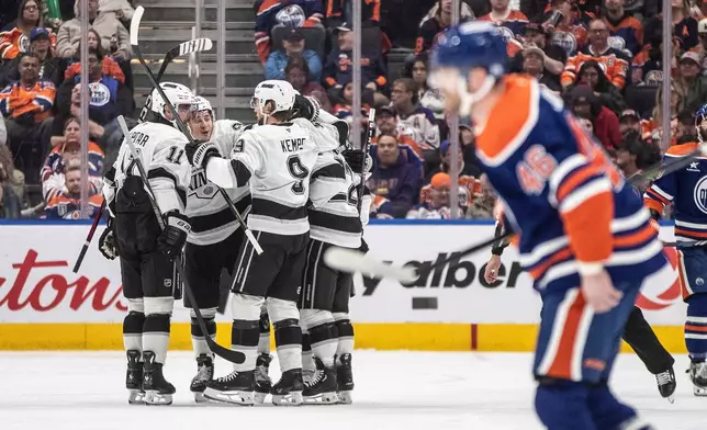 Los Angeles Kings celebrate a goal against the Edmonton Oilers during the second period of an NHL hockey game in Edmonton, Alberta, Monday, April 14, 2025. (Jason Franson/The Canadian Press via AP)