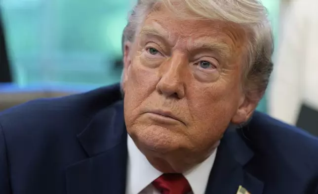 President Donald Trump speaks with reporters after signing executive orders in the Oval Office of the White House, Wednesday, April 23, 2025, in Washington. (AP Photo/Alex Brandon)