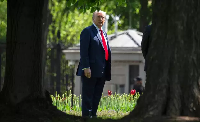 President Donald Trump stands on the North Lawn of the White House in Washington, Wednesday, April 23, 2025. (AP Photo/Mark Schiefelbein)