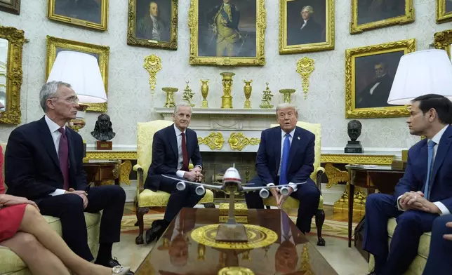 President Donald Trump and Norwegian Prime Minister Jonas Gahr Støre during a bilateral meeting in the Oval Office of the White House, Thursday, April 24, 2025, in Washington. (AP Photo/Mark Schiefelbein)