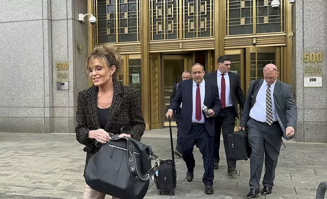 Former Alaska Gov. Sarah Palin, left, leaves Manhattan federal court, Tuesday, April 22, 2025, in New York. A jury has concluded The New York Times did not libel Palin for an error in a 2017 editorial she says damaged her reputation. (AP Photo/Larry Neumeister)
