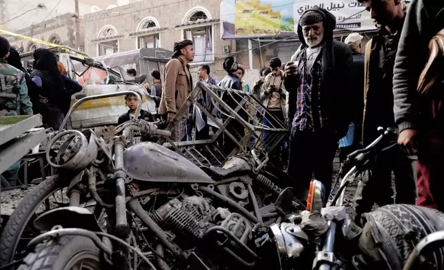 Yemenis look at damaged motorcycles at Farwah popular market, which Houthis said was struck by U.S. airstrikes, in Sanaa, Yemen, Monday, April 21, 2025. (AP Photo)