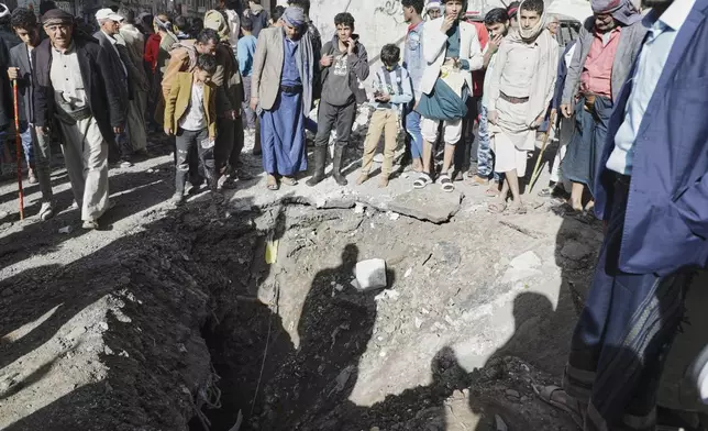 Yemenis watch a crater of an explosion at Farwah popular market which Houthis said it was struck by U.S. airstrikes in Sanaa, Yemen, Monday, April 21, 2025. (AP Photo)