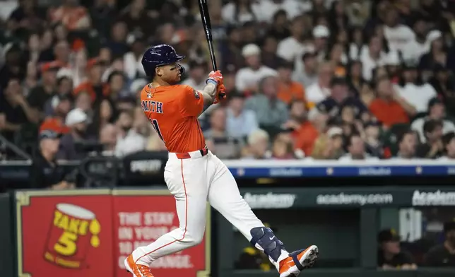 Houston Astros' Cam Smith hits a home run during the second inning of a baseball game against the San Diego Padres in Houston, Friday, April 18, 2025. Yainer Diaz and Jake Meyers also scored.(AP Photo/Ashley Landis)