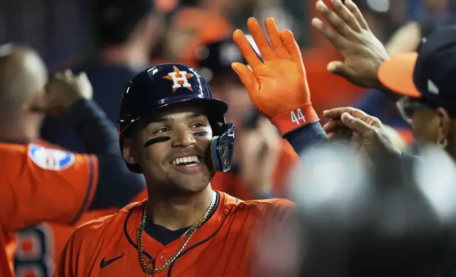 Houston Astros' Cam Smith celebrates the dugout after hitting a home run during the second inning of a baseball game against the San Diego Padres in Houston, Friday, April 18, 2025. Yainer Diaz and Jake Meyers also scored.(AP Photo/Ashley Landis)