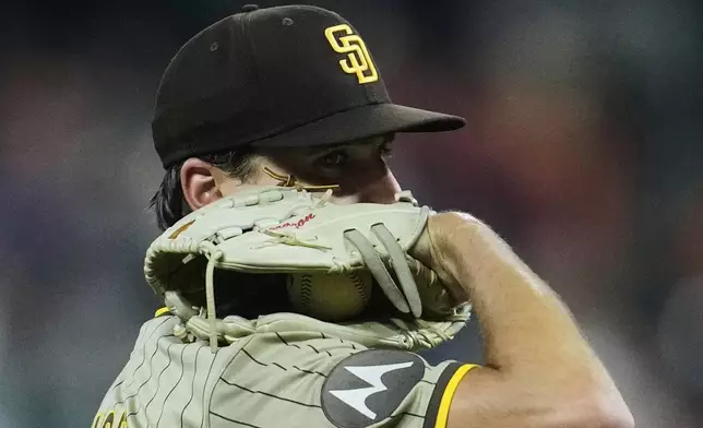 San Diego Padres starting pitcher Kyle Hart prepares to throw during the first inning of a baseball game against the Houston Astros in Houston, Friday, April 18, 2025. (AP Photo/Ashley Landis)