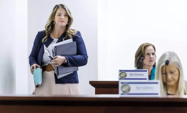 Florida Rep. Fiona McFarland, R-Sarasota, left, enters the Education &amp; Employment Committee, Thursday, April 17, 2025, in Tallahassee, Fla. (AP Photo/Colin Hackley)