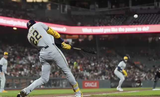 Milwaukee Brewers' Christian Yelich hits a grand slam against the San Francisco Giants during the sixth inning of a baseball game in San Francisco, Tuesday, April 22, 2025. (AP Photo/Jeff Chiu)