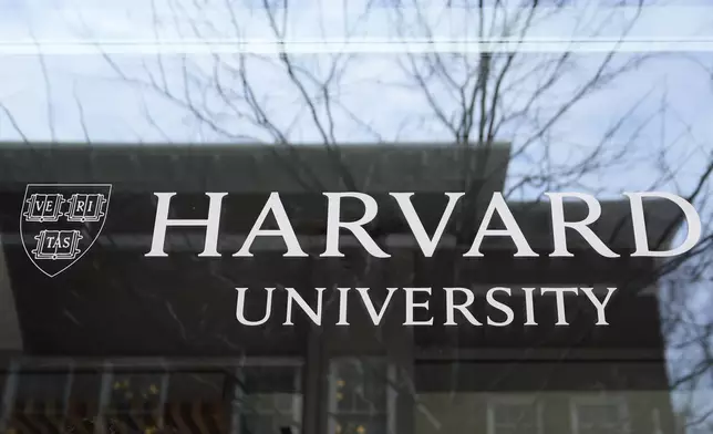 The Harvard University logo is displayed on a building at the school, Tuesday, April 15, 2025, in Cambridge, Mass. (AP Photo/Charles Krupa)