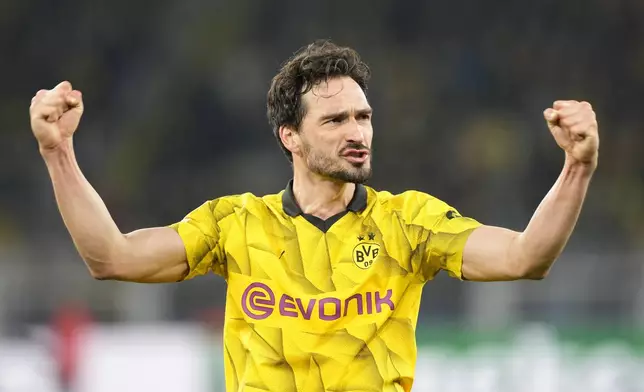 FILE - Dortmund's Mats Hummels celebrates after the Champions League quarterfinal second leg soccer match between Borussia Dortmund and Atletico Madrid at the Signal-Iduna Park in Dortmund, Germany, Tuesday, April 16, 2024(AP Photo/Martin Meissner, File)