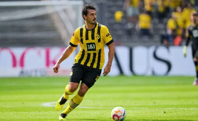 FILE - Dortmund's Mats Hummels plays the ball during the German Bundesliga soccer match between Hertha BSC Berlin and Borussia Dortmund in Berlin, Germany, Saturday, Aug. 27, 2022. (AP Photo/Michael Sohn, File)