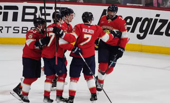 Florida Panthers defenseman Seth Jones (3) celebrates after his goal during the third period in Game 4 of an NHL hockey Stanley Cup first-round playoff series against the Tampa Bay Lightning, Monday, April 28, 2025, in Sunrise, Fla. (AP Photo/Marta Lavandier)