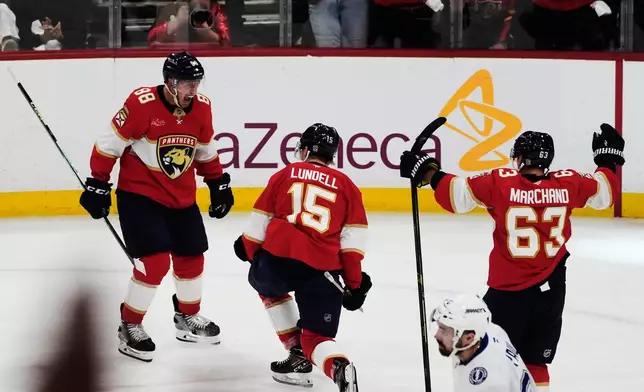 Florida Panthers center Anton Lundell (15) celebrates after his goal during the second period in Game 4 of an NHL hockey Stanley Cup first-round playoff series against the Tampa Bay Lightning, Monday, April 28, 2025, in Sunrise, Fla. (AP Photo/Marta Lavandier)
