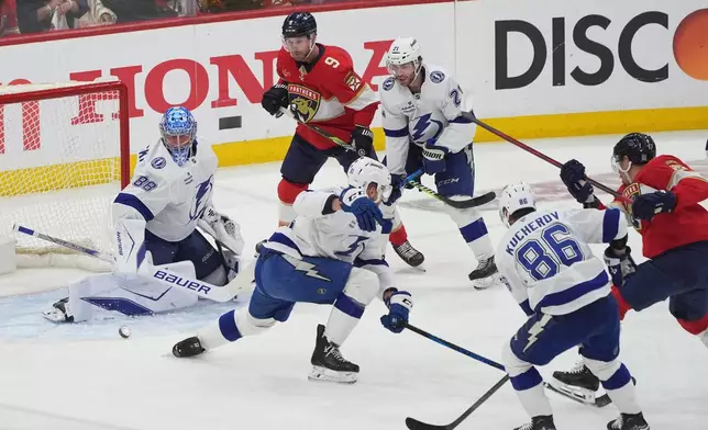 Tampa Bay Lightning goaltender Andrei Vasilevskiy (88) stops a shot on goal during the first period in Game 4 of an NHL hockey Stanley Cup first-round playoff series against the Florida Panthers, Monday, April 28, 2025, in Sunrise, Fla. (AP Photo/Marta Lavandier)