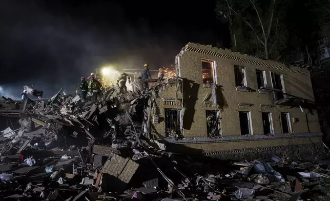 Rescue workers clear the rubble of a house destroyed by a Russian airstrike in Kyiv, Ukraine, on Thursday, April 24, 2025. (AP Photo/Evgeniy Maloletka)