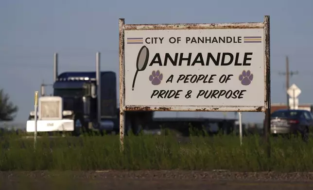 A truck passes through Panhandle, Texas, Tuesday, April 15, 2025. (AP Photo/Eric Gay)