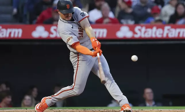 San Francisco Giants' Matt Chapman hits a single during the fourth inning of a baseball game against the Los Angeles Angels in Anaheim, Calif., Saturday, April 19, 2025. (AP Photo/Jessie Alcheh)