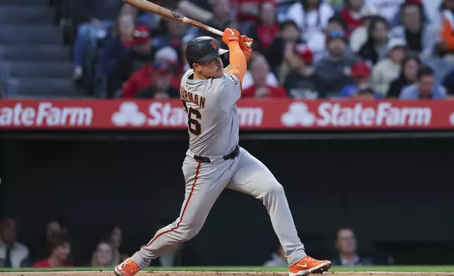 San Francisco Giants' Matt Chapman follows through on a single during the fourth inning of a baseball game against the Los Angeles Angels in Anaheim, Calif., Saturday, April 19, 2025. (AP Photo/Jessie Alcheh)