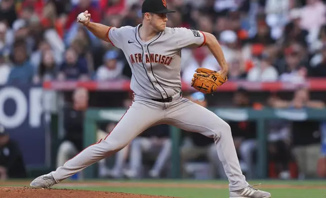 San Francisco Giants pitcher Landen Roupp throws to a Los Angeles Angels batter during the first inning of a baseball game against the Los Angeles Angels in Anaheim, Calif., Saturday, April 19, 2025. (AP Photo/Jessie Alcheh)