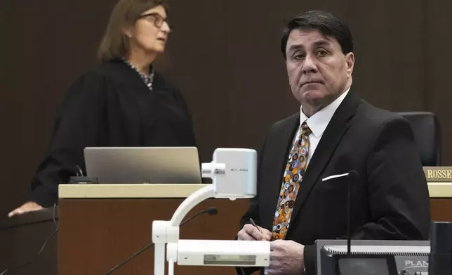 Judge Victoria A. Rossetti, top left, and Robert E. Crimo III's attorney Gregory Ticsay wait for Lake County Assistant State's Attorney Ben Dillon during the sentencing hearing for Robert E. Crimo III., at the Lake County Courthouse, in Waukegan, Ill., Wednesday, April 23, 2025. (AP Photo/Nam Y. Huh, Pool)