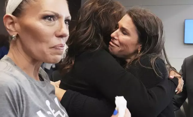 Victims, Keely Roberts, left, Sheila Gutman, center, and Dana Ruder Ring react during the sentencing hearing for Robert E. Crimo III., at the Lake County Courthouse, in Waukegan, Ill., Wednesday, April 23, 2025. (AP Photo/Nam Y. Huh, Pool)