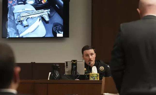 Lake Villa Police Department Sergeant Thomas Dvorak answers a question from Lake County Assistant State's Attorney Ben Dillon during the sentencing hearing for Robert E. Crimo III., at the Lake County Courthouse, in Waukegan, Ill., Wednesday, April 23, 2025. (AP Photo/Nam Y. Huh, Pool)