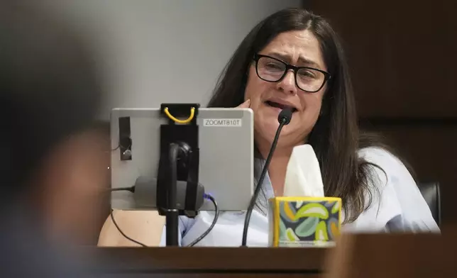 Elizabeth Turnipseed reacts as she reads a victim impact statement during the sentencing hearing for Robert E. Crimo III., at the Lake County Courthouse, in Waukegan, Ill., Wednesday, April 23, 2025. (AP Photo/Nam Y. Huh, Pool)