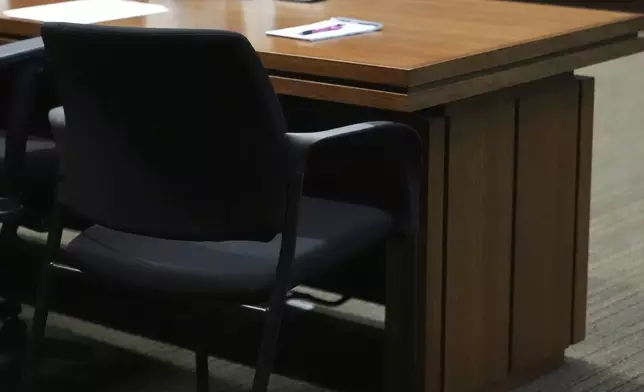 Robert Crimo III, who did not appear, seat is empty at the defense table during the sentencing hearing for Crimo III., at the Lake County Courthouse, in Waukegan, Ill., Wednesday, April 23, 2025. (AP Photo/Nam Y. Huh, Pool)