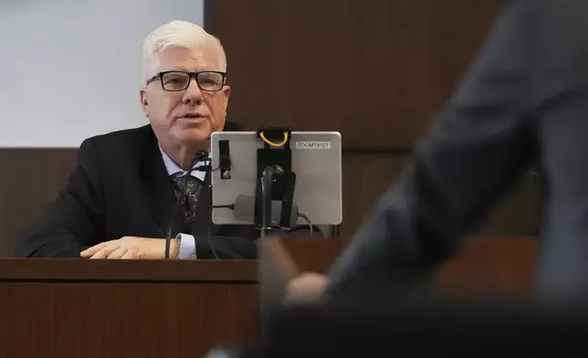 Retired Commander Jerry Cameron from Highland Park Police Department, answers questions from with Lake County, Ill., State's Attorney Eric Rinehart during the sentencing hearing for Robert E. Crimo III., at the Lake County Courthouse, in Waukegan, Ill., Wednesday, April 23, 2025. (AP Photo/Nam Y. Huh, Pool)
