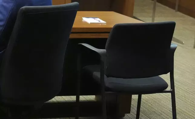 Robert Crimo III, who did not appear, seat is empty at the defense table during the sentencing hearing for Crimo III., at the Lake County Courthouse, in Waukegan, Ill., Wednesday, April 23, 2025. (AP Photo/Nam Y. Huh, Pool)