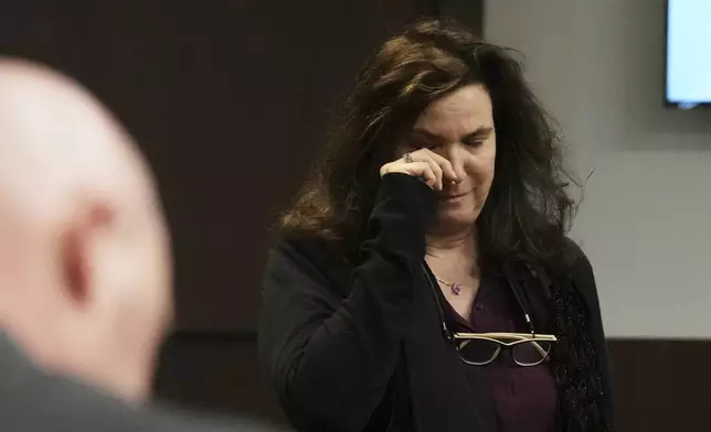 Cynthia Straus wipes her eyes after reading a victim impact statement during the sentencing hearing for Robert E. Crimo III., at the Lake County Courthouse, in Waukegan, Ill., Wednesday, April 23, 2025. (AP Photo/Nam Y. Huh, Pool)