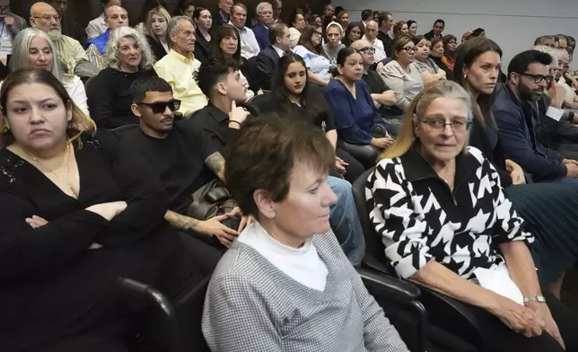 Victims family and media members wait before the sentencing hearing for Robert E. Crimo III., at the Lake County Courthouse, in Waukegan, Ill., Wednesday, April 23, 2025. (AP Photo/Nam Y. Huh, Pool)
