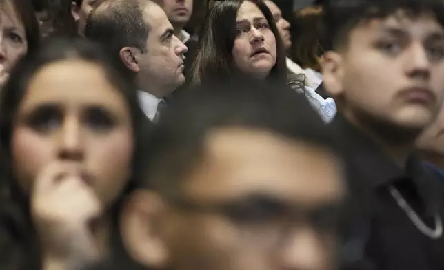 Elizabeth Turnipseed, top right, and Victims family members react during the sentencing hearing for Robert E. Crimo III., at the Lake County Courthouse, in Waukegan, Ill., Wednesday, April 23, 2025. (AP Photo/Nam Y. Huh, Pool)