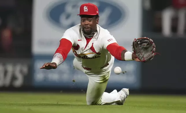 St. Louis Cardinals right fielder Jordan Walker is unable to catch an RBI single by Houston Astros' Jake Meyers during the sixth inning of a baseball game Tuesday, April 15, 2025, in St. Louis. (AP Photo/Jeff Roberson)